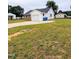 Charming exterior view with a well-manicured lawn and a single-car garage at 1602 Fairground Rd, Dunn, NC 28334