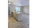 Bright kitchen features gray cabinets, granite counters and a central island with a sink at 1602 Fairground Rd, Dunn, NC 28334