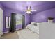 Purple bedroom with ceiling fan, daybed and side mirror at 1609 Forest Rd, Wake Forest, NC 27587