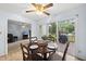 Cozy dining area featuring a wooden table and chairs, with sliding glass doors leading to an outdoor deck at 1609 Forest Rd, Wake Forest, NC 27587