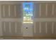 Drywall with a large window in a room showcasing the scenic outdoor view at 163 Batten Hill Ln, Selma, NC 27576