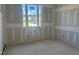 A bright bedroom with a large window framing the outdoor view at 163 Batten Hill Ln, Selma, NC 27576
