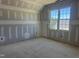 Bedroom with a vaulted ceiling and a window for natural light at 163 Batten Hill Ln, Selma, NC 27576