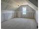 A versatile bonus room featuring sloped ceilings and a window at 163 Batten Hill Ln, Selma, NC 27576