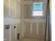 A convenient laundry room with a window bringing in natural light at 163 Batten Hill Ln, Selma, NC 27576