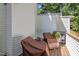 Back deck features chairs and a view of the backyard at 166 Greenmont Ln, Cary, NC 27511