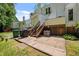 Backyard features a patio and stairs leading to a back deck at 166 Greenmont Ln, Cary, NC 27511