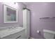 Bathroom features marble vanity, mirror, and storage cabinet at 166 Greenmont Ln, Cary, NC 27511