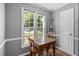 Cozy dining area with a wooden table and chairs bathed in natural light at 166 Greenmont Ln, Cary, NC 27511