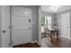 Welcoming entryway with hardwood floors, gray walls, and a dining area with natural light at 166 Greenmont Ln, Cary, NC 27511