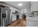 Well-appointed kitchen with stainless steel appliances and white cabinetry at 166 Greenmont Ln, Cary, NC 27511