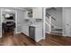 Modern kitchen with a stainless steel dishwasher, and staircase access at 166 Greenmont Ln, Cary, NC 27511