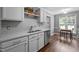 Modern kitchen featuring stainless steel appliances and a view of a dining area at 166 Greenmont Ln, Cary, NC 27511