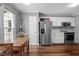 Bright kitchen featuring stainless steel appliances, subway tile backsplash, and ample cabinetry at 166 Greenmont Ln, Cary, NC 27511