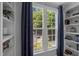 Cozy window seat area in bedroom features built-in bookshelves and lots of light at 166 Greenmont Ln, Cary, NC 27511