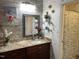Modern bathroom with marble-look walls, granite countertop and decorative shelves adding a touch of elegance at 1944 Castle Pines Dr, Raleigh, NC 27604