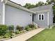 Well-maintained home featuring a walkway with flowerbeds and manicured lawn at 1944 Castle Pines Dr, Raleigh, NC 27604