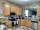 Well-lit kitchen with modern stainless steel appliances and granite countertops at 1944 Castle Pines Dr, Raleigh, NC 27604