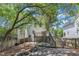 Backyard with deck, stairs, garden, firepit, and lovely landscaping at 2204 Bellaire Ave, Raleigh, NC 27608