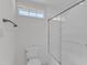Bright bathroom featuring tile flooring, bathtub shower, and window for natural light at 2204 Bellaire Ave, Raleigh, NC 27608