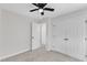 Bedroom featuring ceiling fan, large closet, and access to additional room at 2204 Bellaire Ave, Raleigh, NC 27608