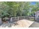 Exterior deck features wood flooring and railings overlooking backyard at 2204 Bellaire Ave, Raleigh, NC 27608