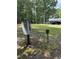 Outdoor view of utility connections in a wooded yard with the home in the background at 225 Meadow Dr, Henderson, NC 27537