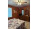 Bedroom featuring a dresser with mirrors, carpet, and natural light, offering plenty of storage and a comfortable feel at 225 Meadow Dr, Henderson, NC 27537