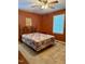 Comfortable bedroom with carpet, a decorative headboard, and a bright window, creating a cozy and inviting space at 225 Meadow Dr, Henderson, NC 27537
