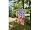 Welcome to Our Happy Place sign displayed on landscaped yard at 225 Meadow Dr, Henderson, NC 27537
