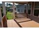 Covered back porch overlooking the well-manicured lawn and backyard at 2309 Redbridge Ln, Apex, NC 27502