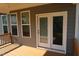 Covered back porch with direct access to the backyard through sliding glass doors at 2309 Redbridge Ln, Apex, NC 27502