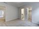 Neutral bedroom with 2 open doorways to the ensuite bathroom and walk-in closet at 2309 Redbridge Ln, Apex, NC 27502