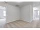 A bright bedroom with neutral carpet and doorways leading to other rooms at 2309 Redbridge Ln, Apex, NC 27502