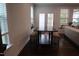Cozy dining area next to the living room, featuring a table with built-in benches and ample natural light at 2309 Redbridge Ln, Apex, NC 27502