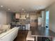 Bright kitchen with stainless appliances, pendant lighting, and island seating at 2309 Redbridge Ln, Apex, NC 27502