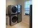 Efficient laundry area features a stackable washer and dryer at 2309 Redbridge Ln, Apex, NC 27502