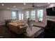 Bright living room with large windows, a fireplace, and comfortable seating, creating a cozy atmosphere at 2309 Redbridge Ln, Apex, NC 27502