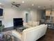 Inviting living room with comfortable seating and a piano at 2309 Redbridge Ln, Apex, NC 27502