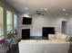 Open-concept living room featuring a fireplace at 2309 Redbridge Ln, Apex, NC 27502