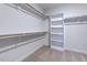 Walk-in closet with shelving and racks at 2309 Redbridge Ln, Apex, NC 27502