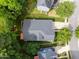 Aerial view of home showing roof, landscaping, driveway, and nearby trees at 2313 Filigree Ct, Raleigh, NC 27614
