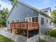 Back exterior view of home featuring white trim, blue siding, and a back deck at 2313 Filigree Ct, Raleigh, NC 27614