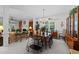 Open dining area connected to the living room, featuring a chandelier and large table at 2313 Filigree Ct, Raleigh, NC 27614