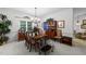 Elegant dining room with chandelier, china cabinet, and ample natural light at 2313 Filigree Ct, Raleigh, NC 27614