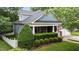 Beautiful home featuring a large porch, mature landscaping, and architectural detail at 2313 Filigree Ct, Raleigh, NC 27614