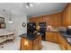 Updated kitchen includes stainless steel appliances, wooden cabinets, an island, and a breakfast area at 2313 Filigree Ct, Raleigh, NC 27614