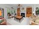 Cozy living room with fireplace, built-in shelving, and comfortable seating at 2313 Filigree Ct, Raleigh, NC 27614