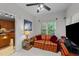 Cozy living room with striped sofa and TV, connected to kitchen at 2313 Filigree Ct, Raleigh, NC 27614
