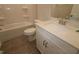 Well-lit bathroom with a shower-tub combination, modern vanity, and tile flooring at 2733 Hunter Woods Dr # 570, Apex, NC 27502